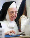 Elderly nun on the computer